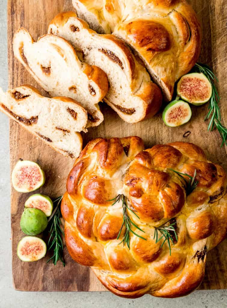 A mixture of dried figs, honey and cinnamon are cooked down into a paste and pressed into strands of challah. After baked and sliced, the dried fruit peeks out into swirls.