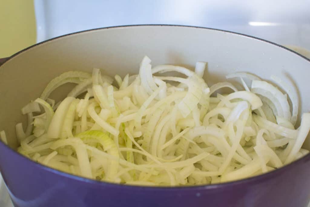 To start French onion soup, In a large and wide dutch, melt butter and oil together and add all of your onions.