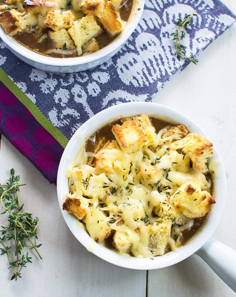 Garnish French onion soup with more fresh thyme and serve immediately. 