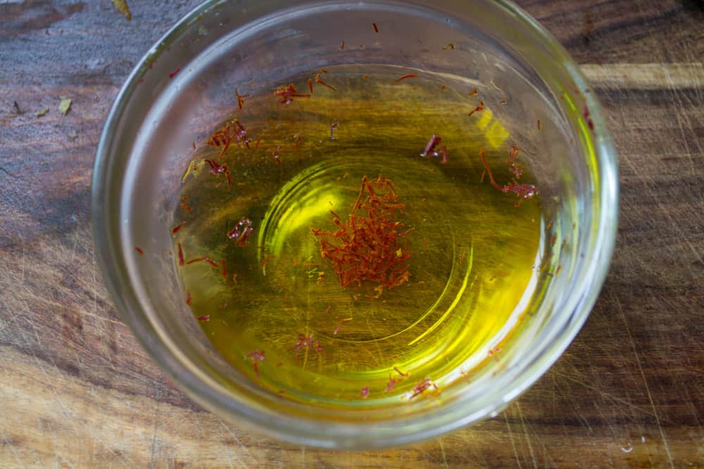 a small bowl soak a generous pinch of saffron in warm water. Allow to soak while setting up other ingredients for the Persian rice.