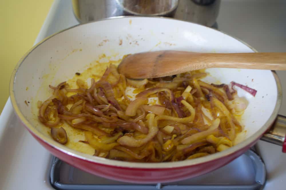 In a separate pan, saute sliced onion in 1 Tb butter and oil until caramelized. About 10 minutes. Add turmeric and mix together well.