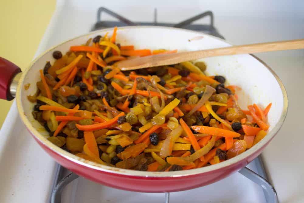 Add candied carrot and orange to the mixture to the fruit and onions and toss well.