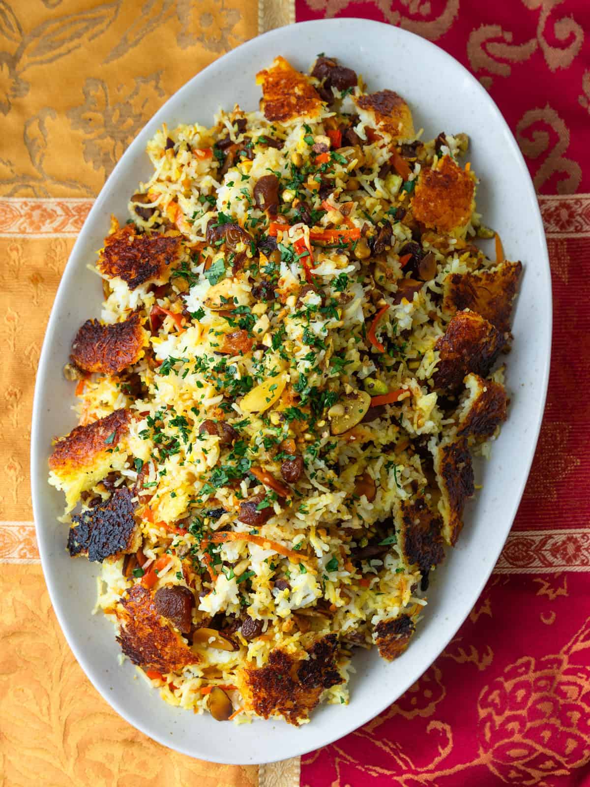 Colorful Persian jeweled rice with nuts, dried fruit and saffron tahdig. 