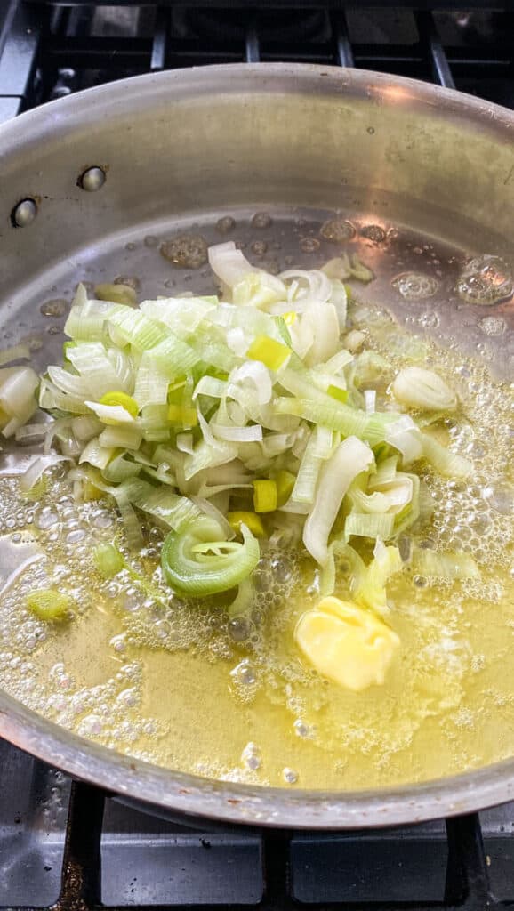 Once butter is melted, add sliced leeks and saute for a few minutes to soften.