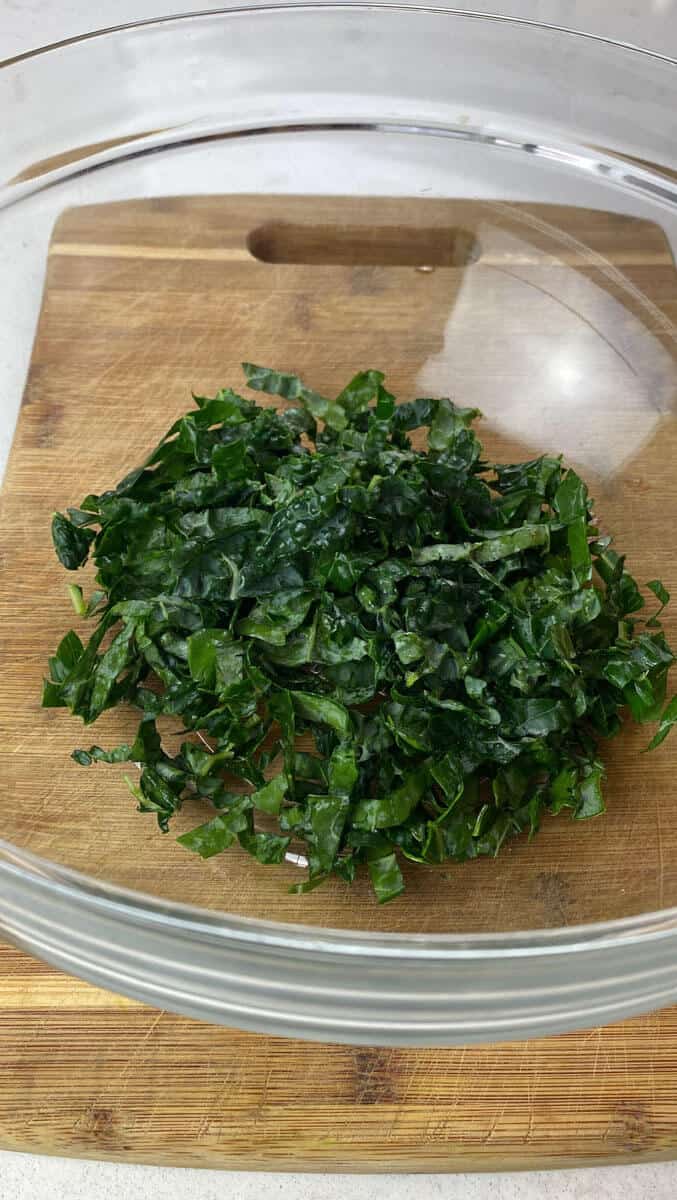 Add the shredded dino kale to a large bowl.