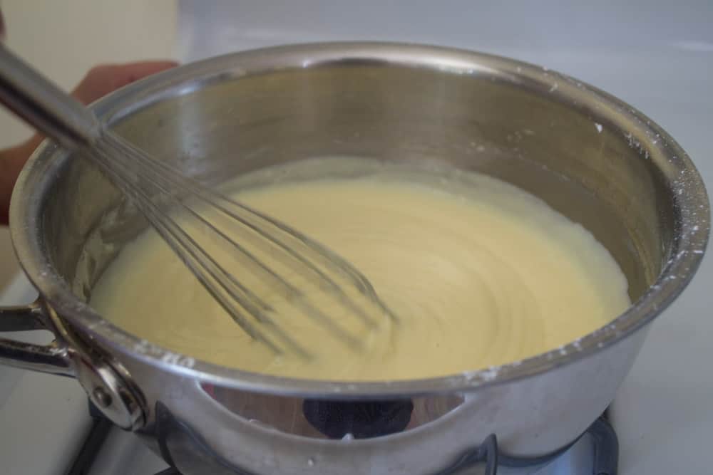 Whisk the pastry cream until smooth and thick.