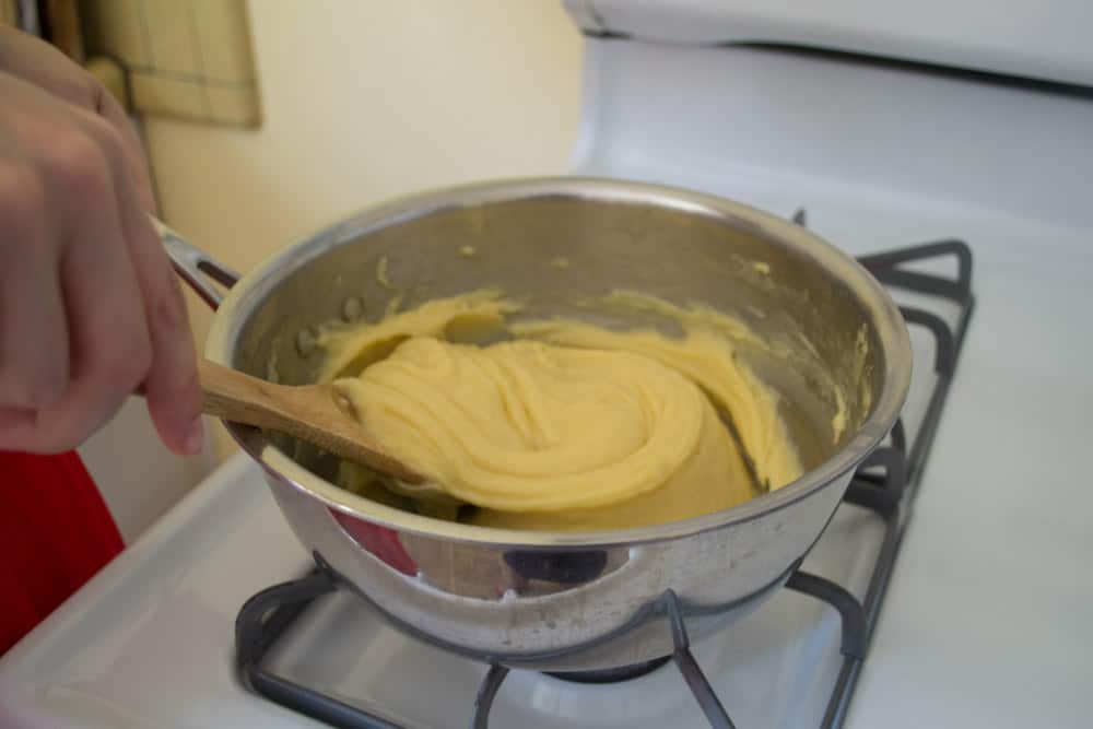 Stir the flour into the butter and egg mixture until a dough forms for the pastry dough.