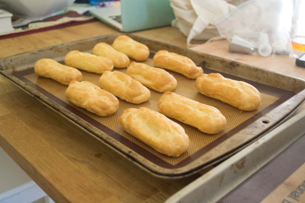 Bake at 425 degrees Fahrenheit for 10 minutes then reduce the heat to 250 degrees F and continue baking for another 20 minutes or until all the pate choux is golden brown. When done, remove from oven and allow to cool completely.
