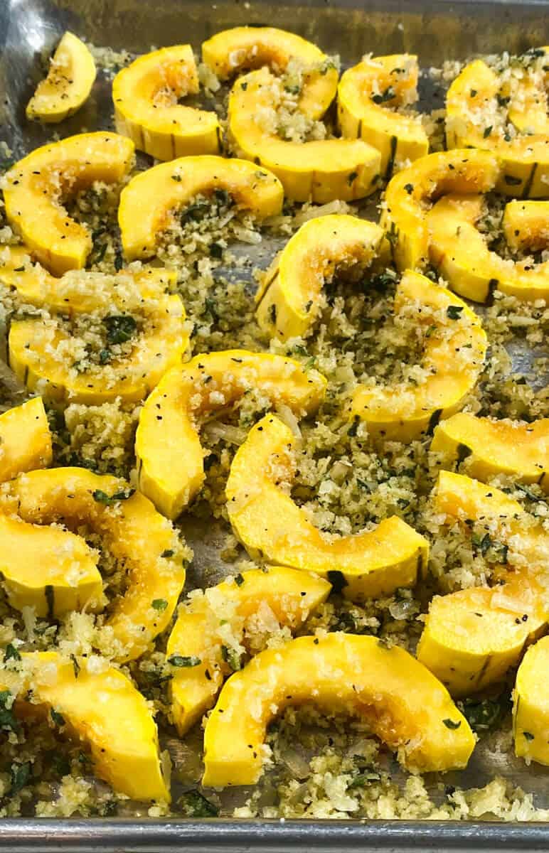 Toss the delicata squash with the breadcrumb mixture so it's evenly coated.