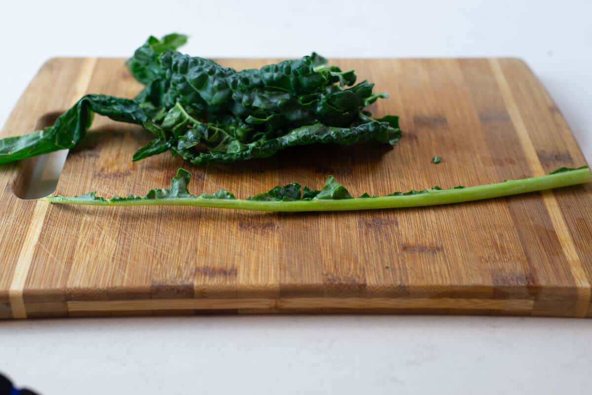 Once the leaves are removed from the dino kale, discard the thick stem.