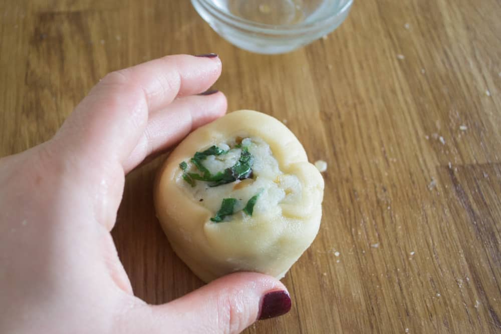 Form each knish into a round knish and pinch the dough on one side so it's secure.