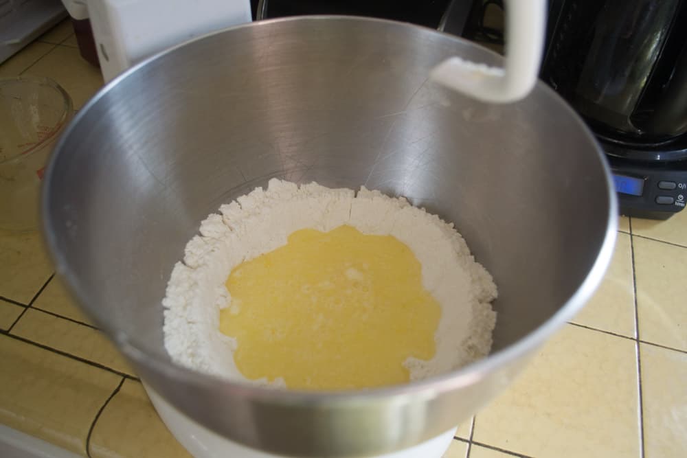 To a mixer, add flour, egg, oil, vinegar and water and begin to mix on low.