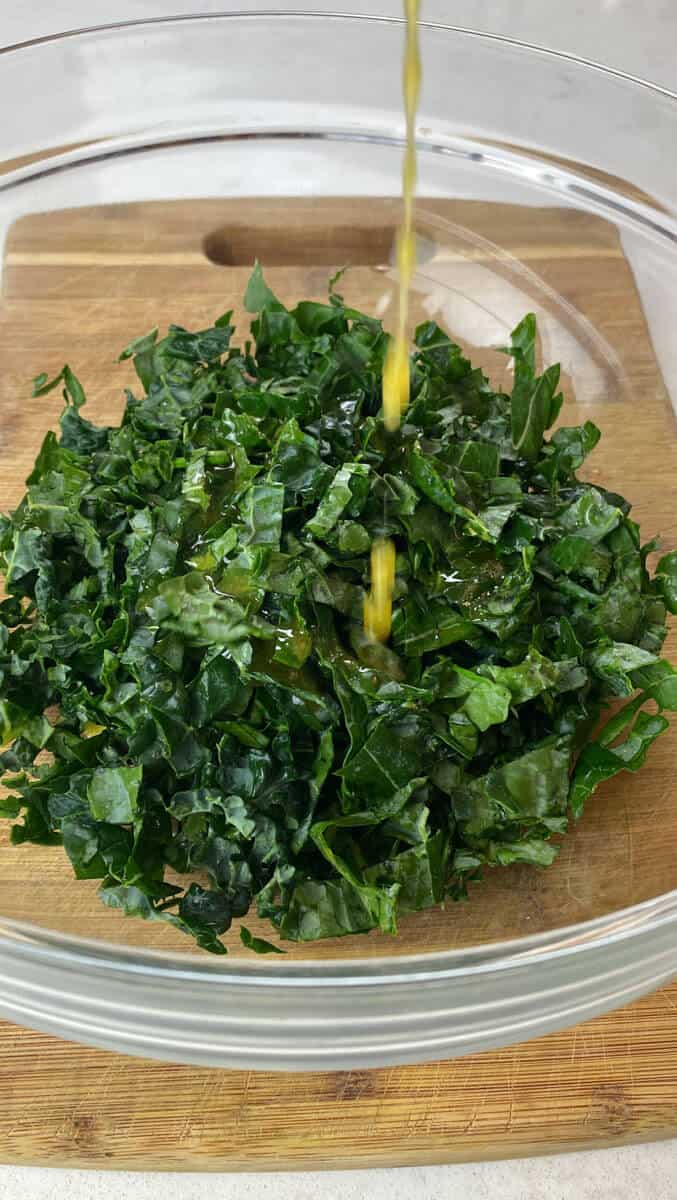 Add maple vinaigrette to the shredded kale before massaging it.