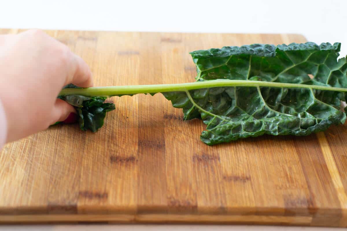 Remove the leaves from the kale stem.