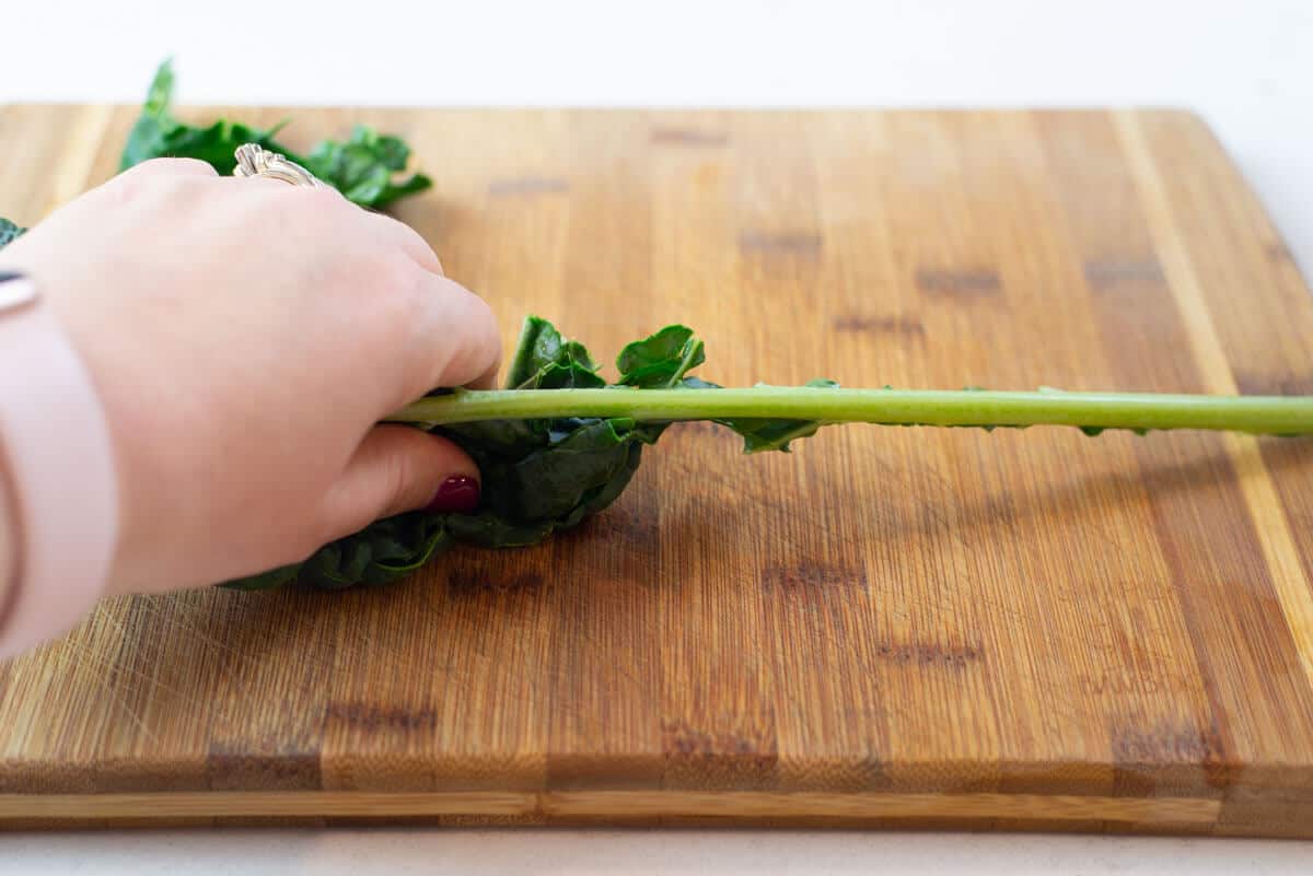 Remove the dino kale leaves from the stem.