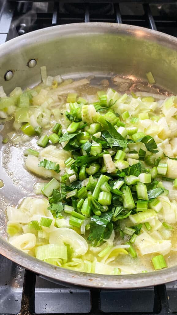 Once the leeks are sautéed, add chopped celery and saute for a few minutes.