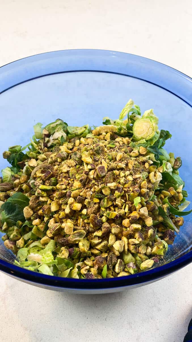 Add choppped pistachios to the parmesan brussels sprouts salad. 