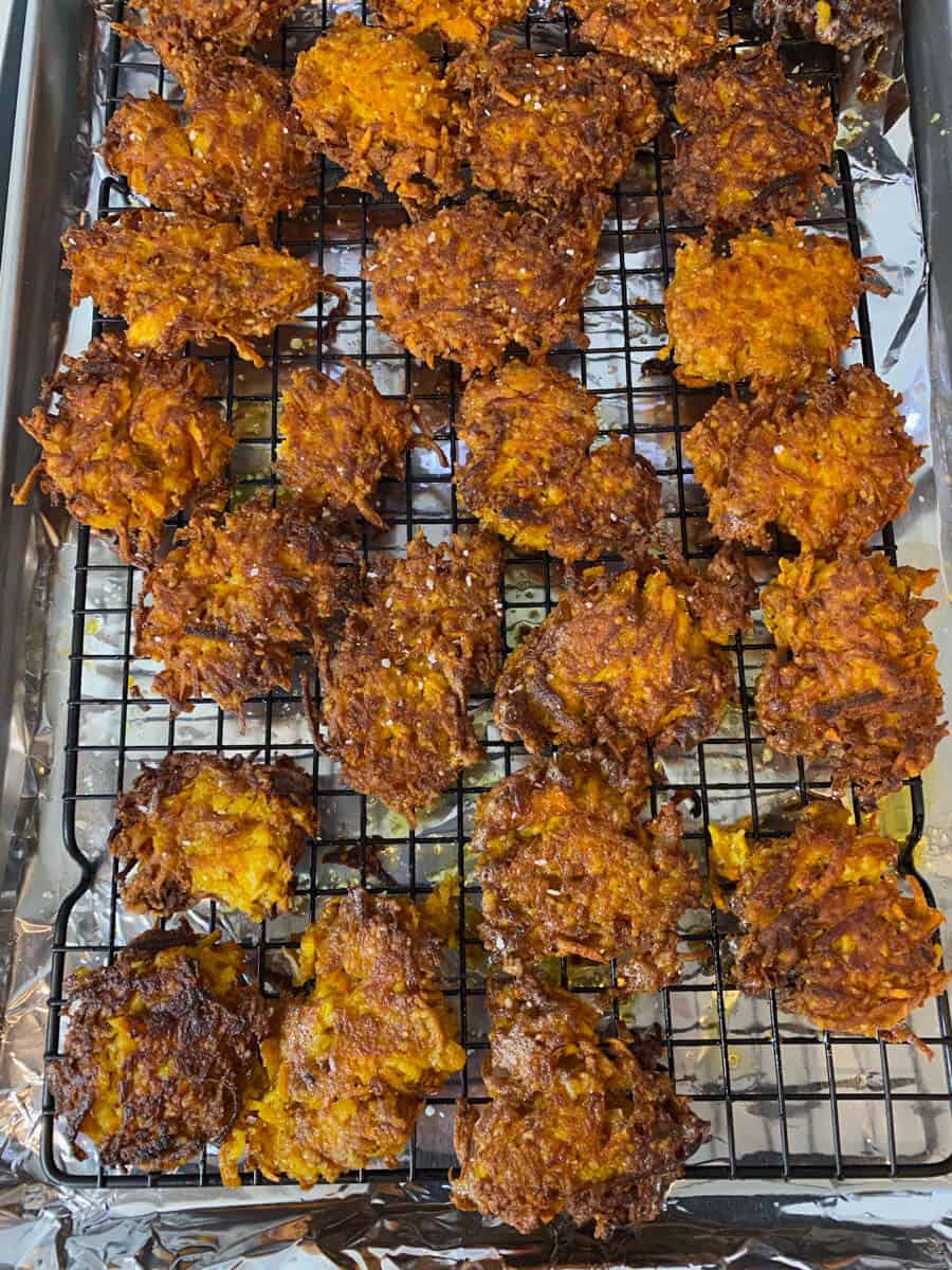 Lay the fried latkes on a wire rack to drain.