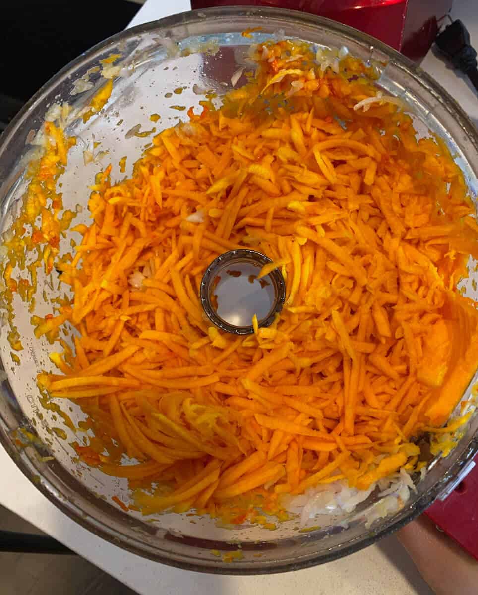 Shred the butternut squash with the shred attachment in a food processor.