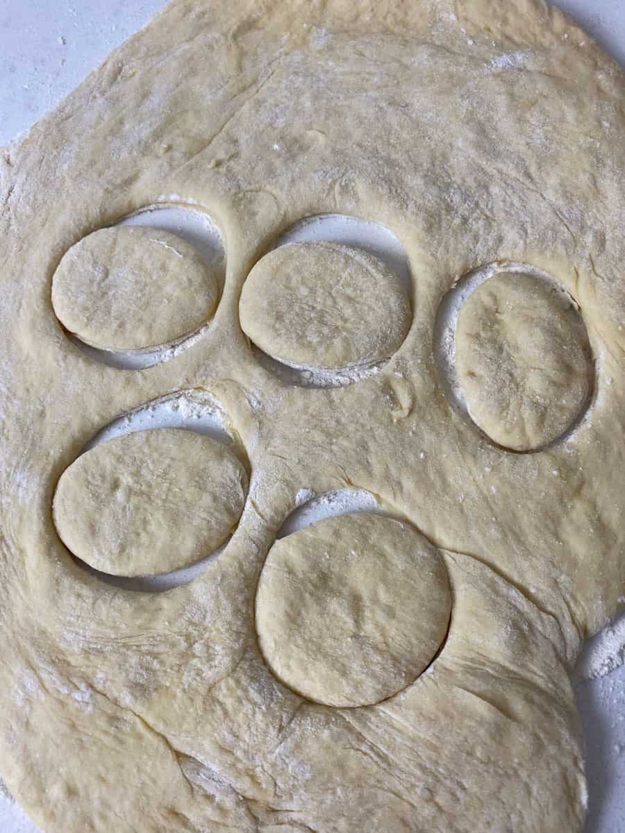 Roll out the donut dough and use a 3 inch round cookie cutter to cut out circles.