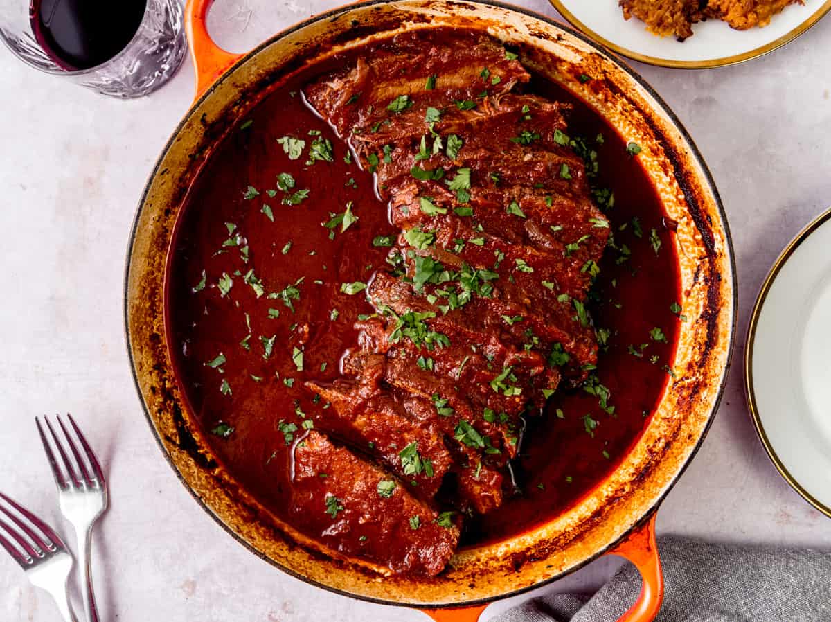 Braised beef brisket in a rich sweet and sour tomato sauce.