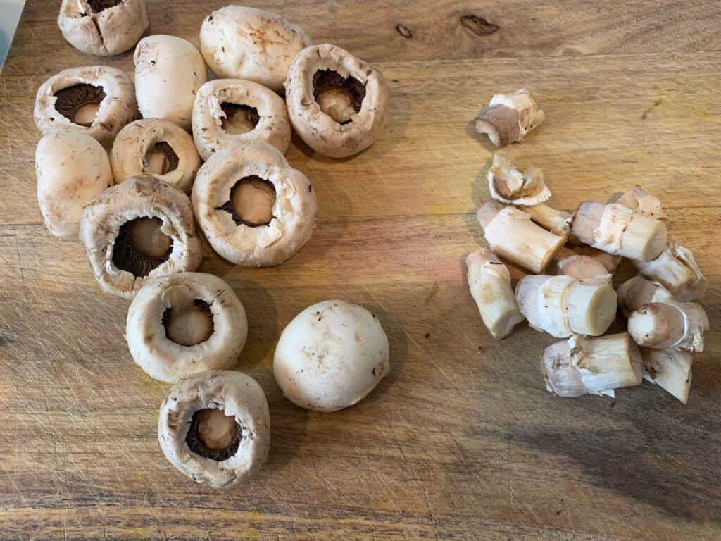 Remove the stems from button mushrooms.