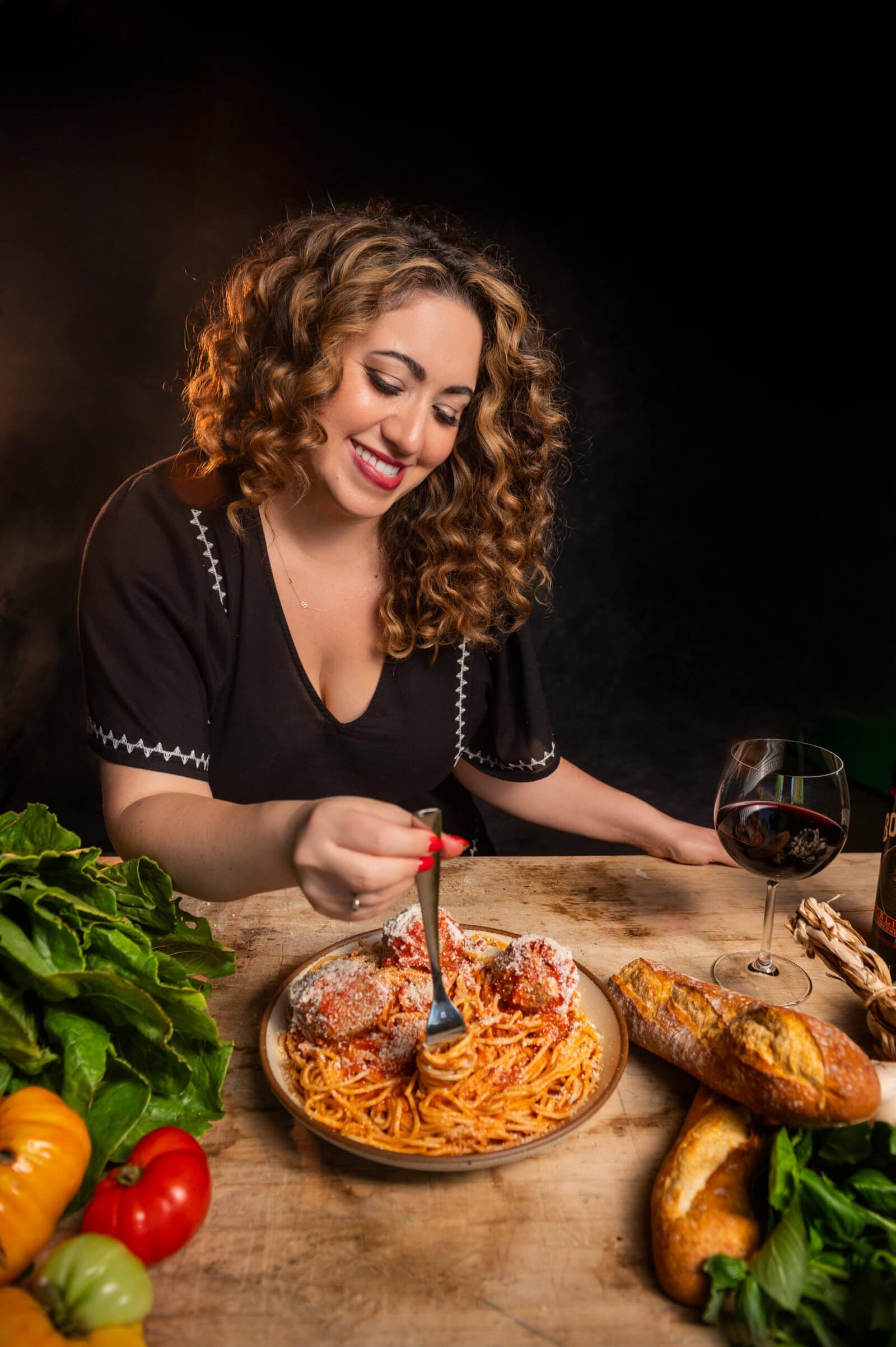 Samantha Ferraro twirling pasta headshot.