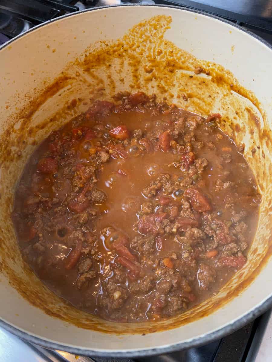 Continue cooking the bolognese sauce until sauce has thickened and reduced.