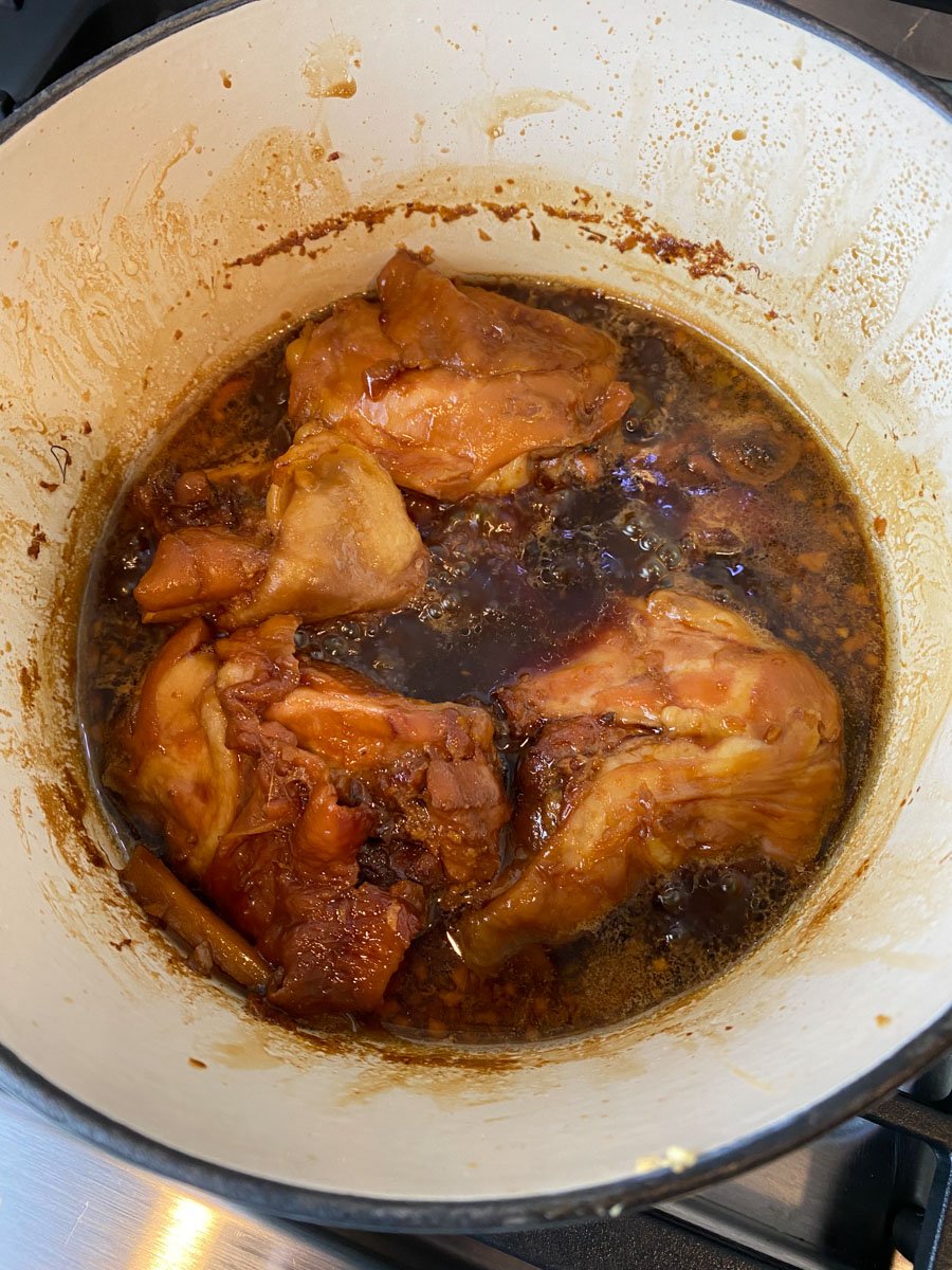 Cook the chicken thighs in the shoyu sauce until the chicken is cooked through.