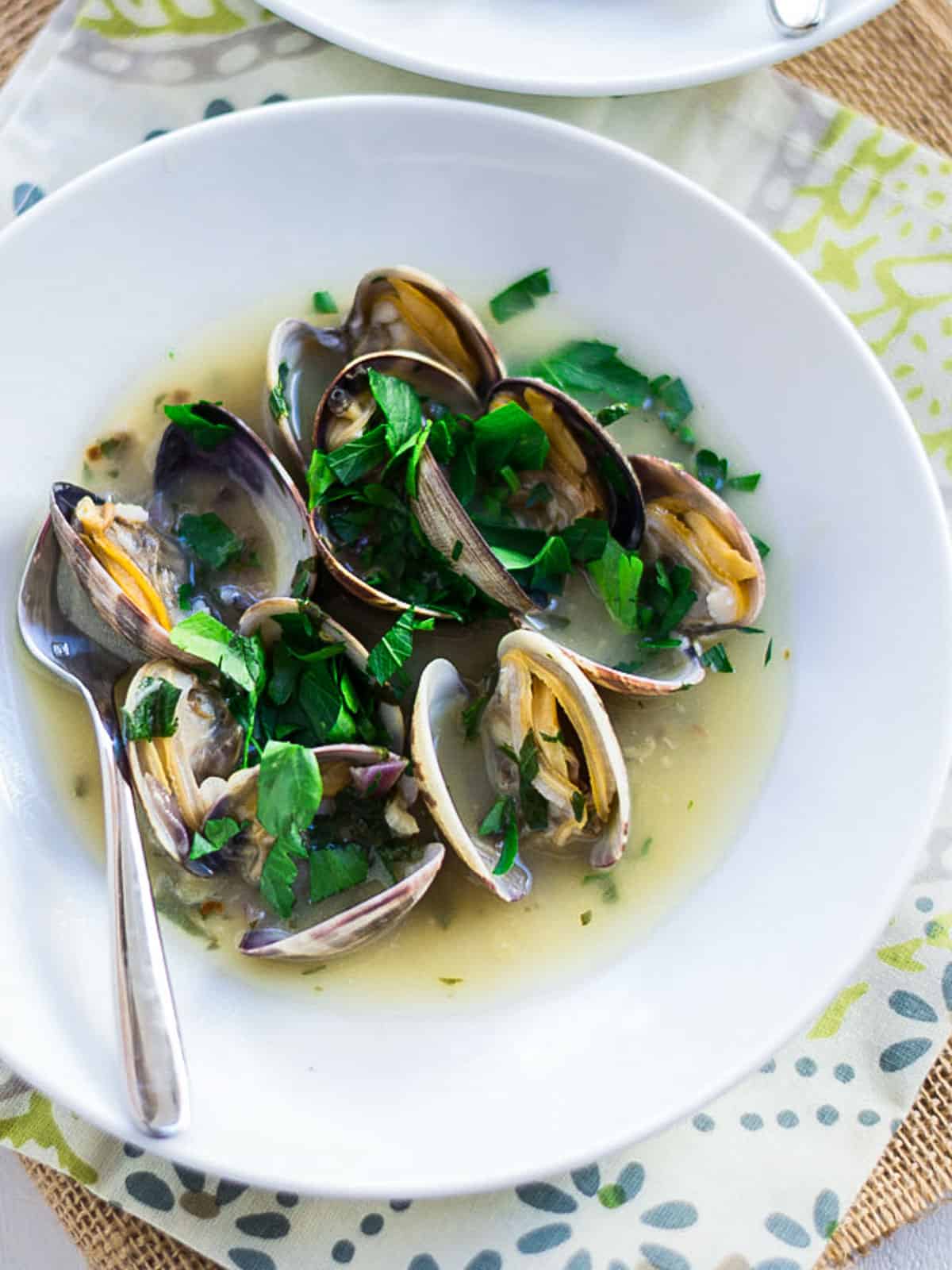 Spanish style clams in salsa verde with white, olive oil and fresh parsley.