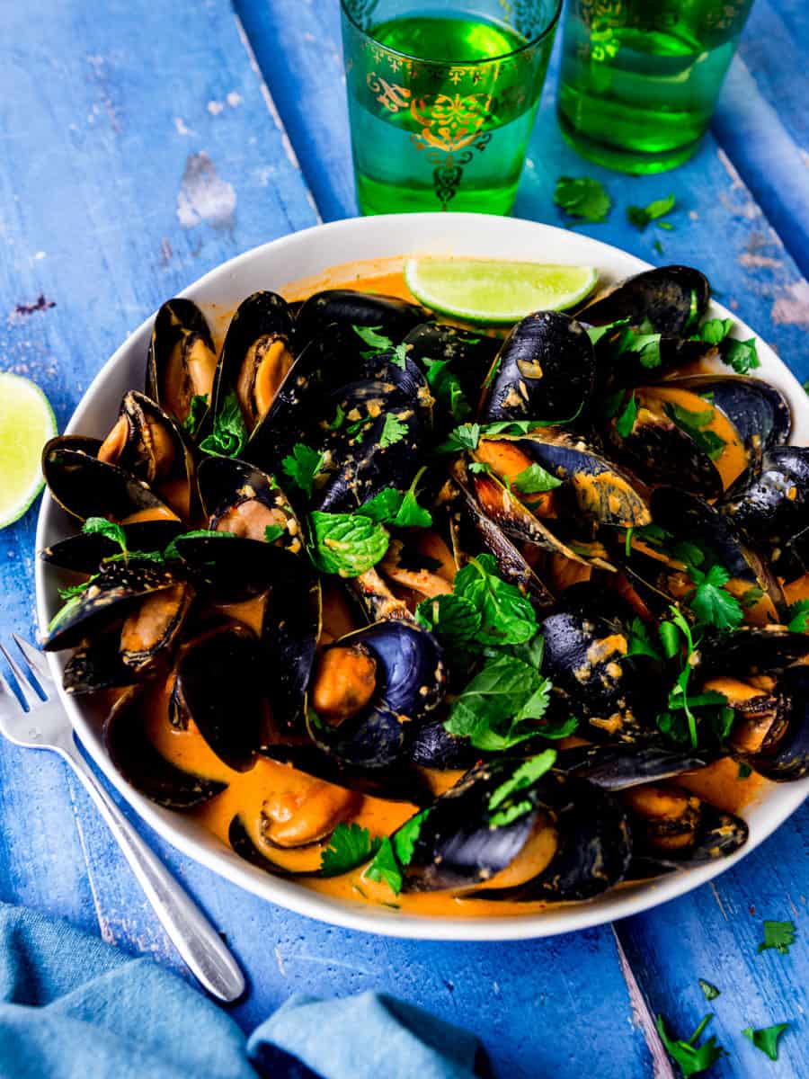 Steamed mussels in a coconut curry broth with lime and fresh herbs.