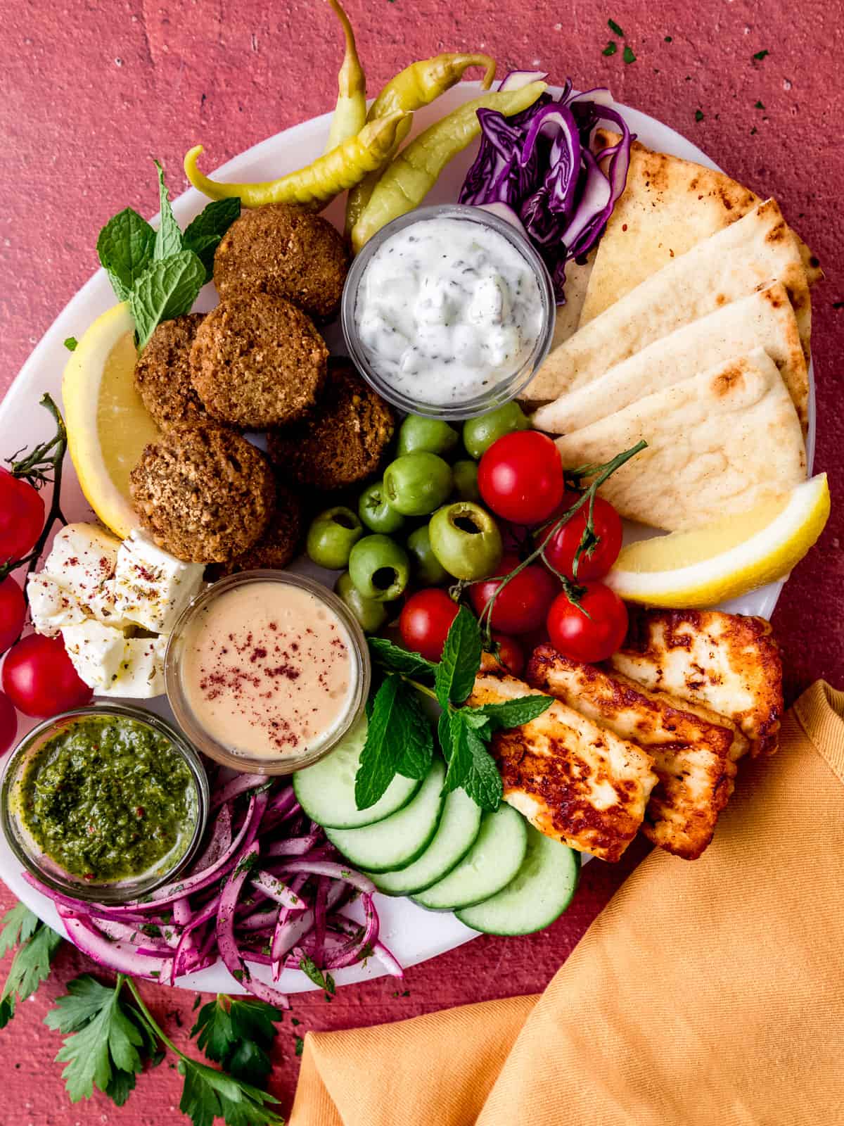 This falafel platter is filled with homemade falafel, tzatziki sauce and zhoug and everything you need to make a falafel wrap!