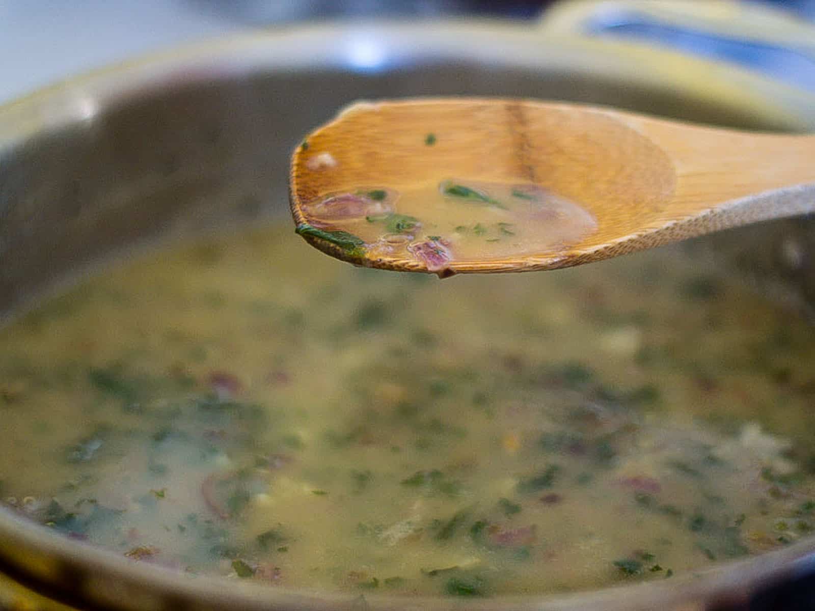 Simmer the green sauce until slightly thickened.