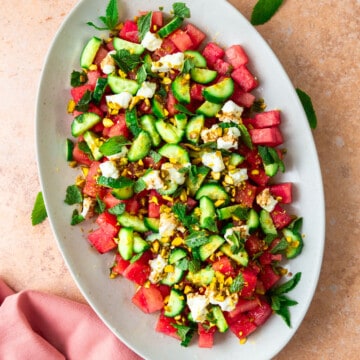 Fresh watermelon salad with crumbles of goat cheese, cucumber and finished with chopped pistachios.