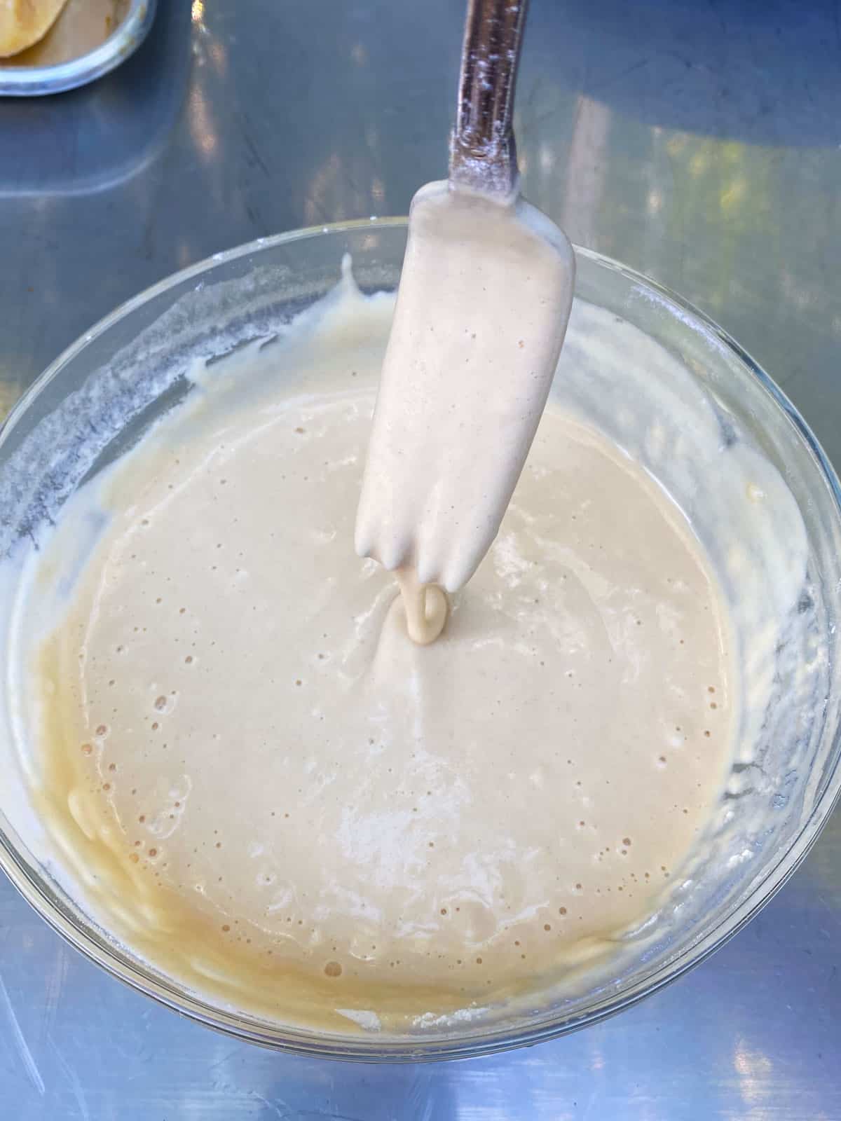 Whisk the fritter batter until thickened.