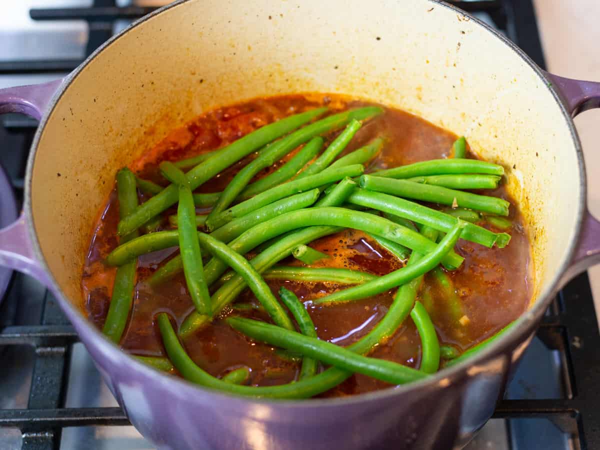 Add the fresh green beans right on top of the beef stew.