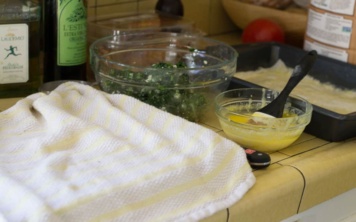 Cover the phyllo sheets with a damp towel to keep the phyllo from drying out.