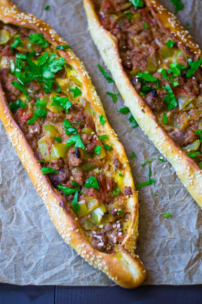 Turkish pide with ground beef, spices, tomatoes and peppers.