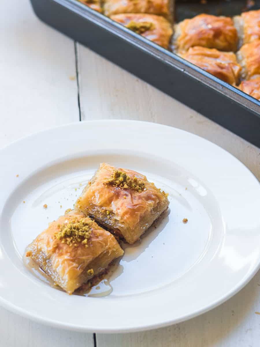 Turkish baklava with pistachios and doused in an orange water simple syrup.
