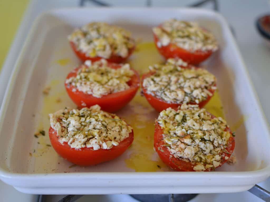 Stuff the tomato halves with the parmesan mixture and drizzle with olive oil.