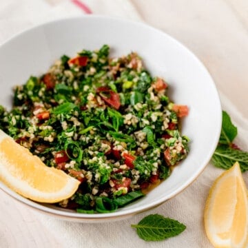 Lebanese tabbouleh salad topped with fresh lemon and green onions.