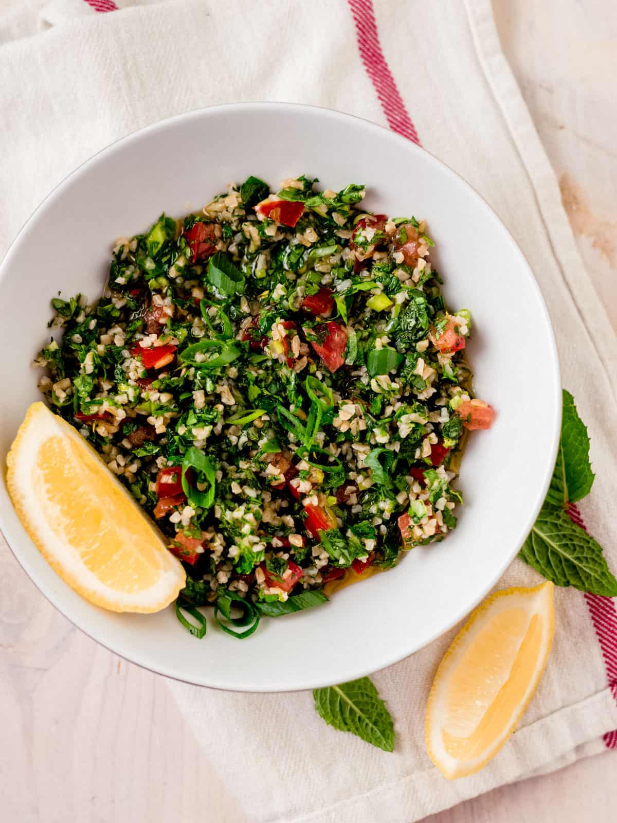 Lebanese style tabbouleh salad with fine bulgur and lots of fresh parsley, mint and green onions.