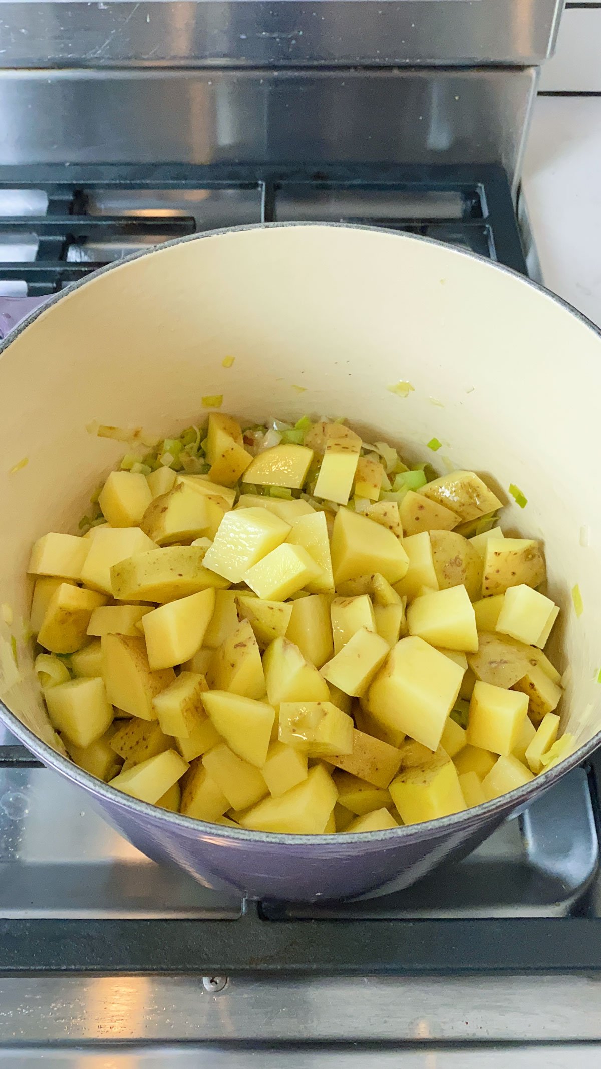 Add the cubed potatoes to the leeks.