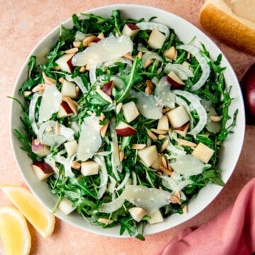 Arugula salad with shaved parmesan and chopped pear.