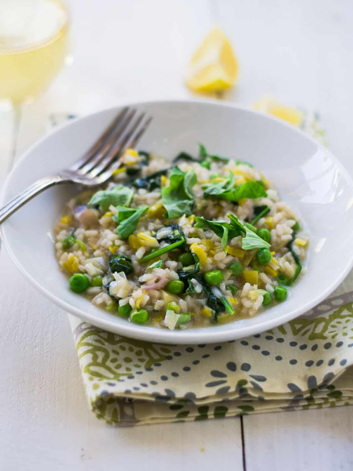 Lemon spinach risotto with peas and parmesan.
