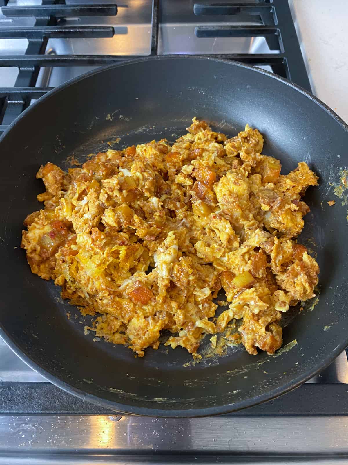 Scramble the eggs with the chorizo and potatoes until the eggs are just cooked through.
