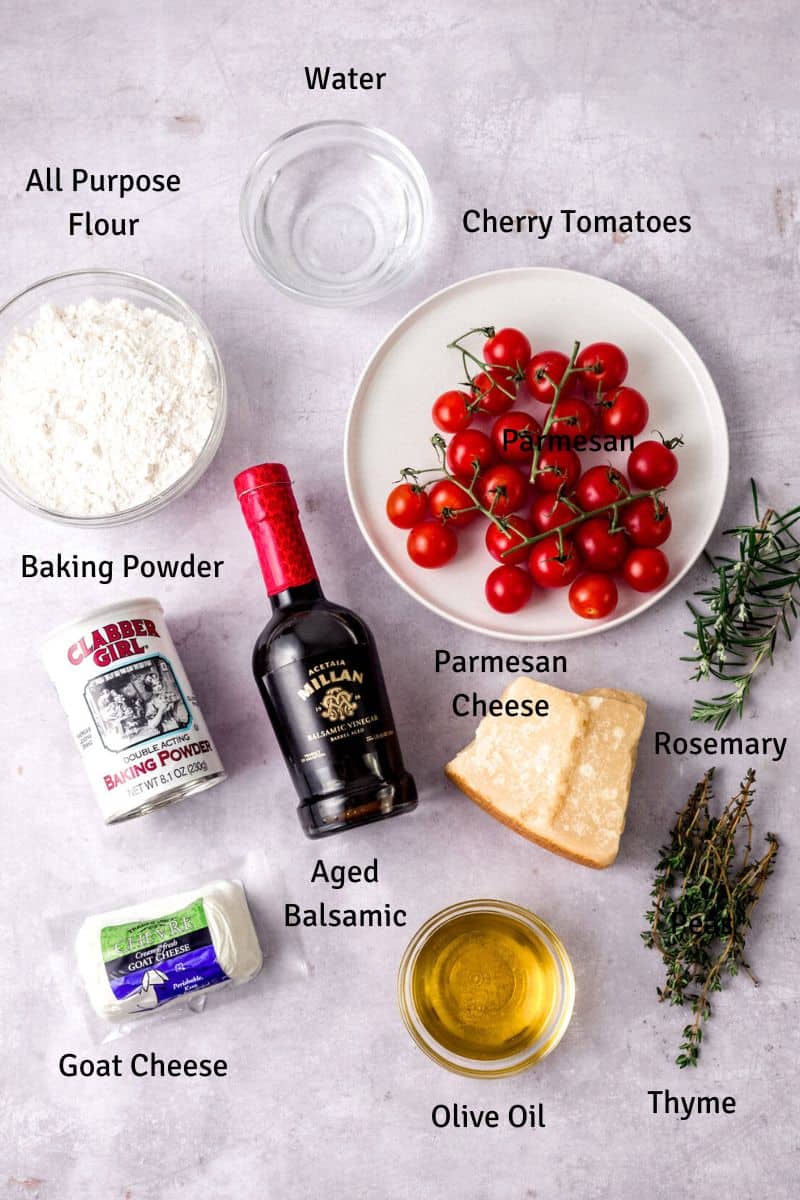 Ingredients for cheese and tomato flatbread, including herbs and aged balsamic.