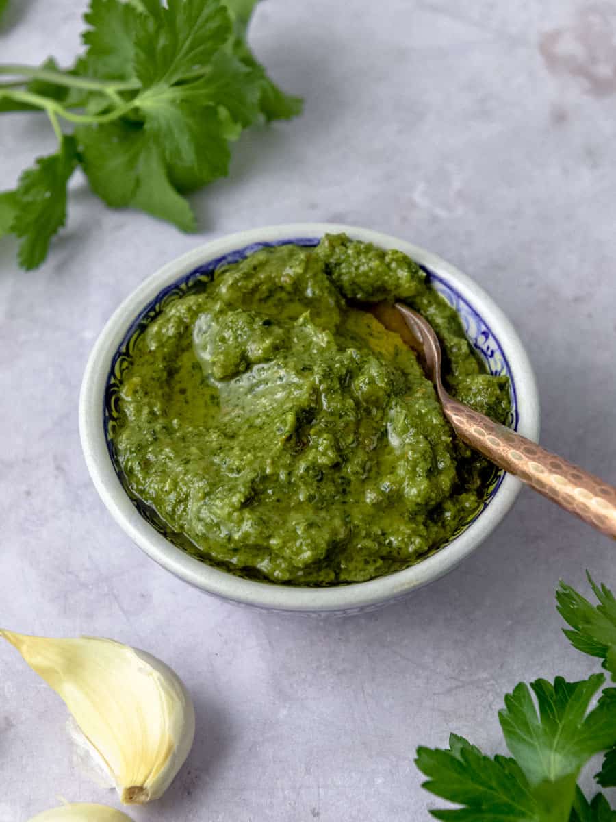 Zhug sauce is a spicy herb sauce with garlic, fresh herbs and warm spices.