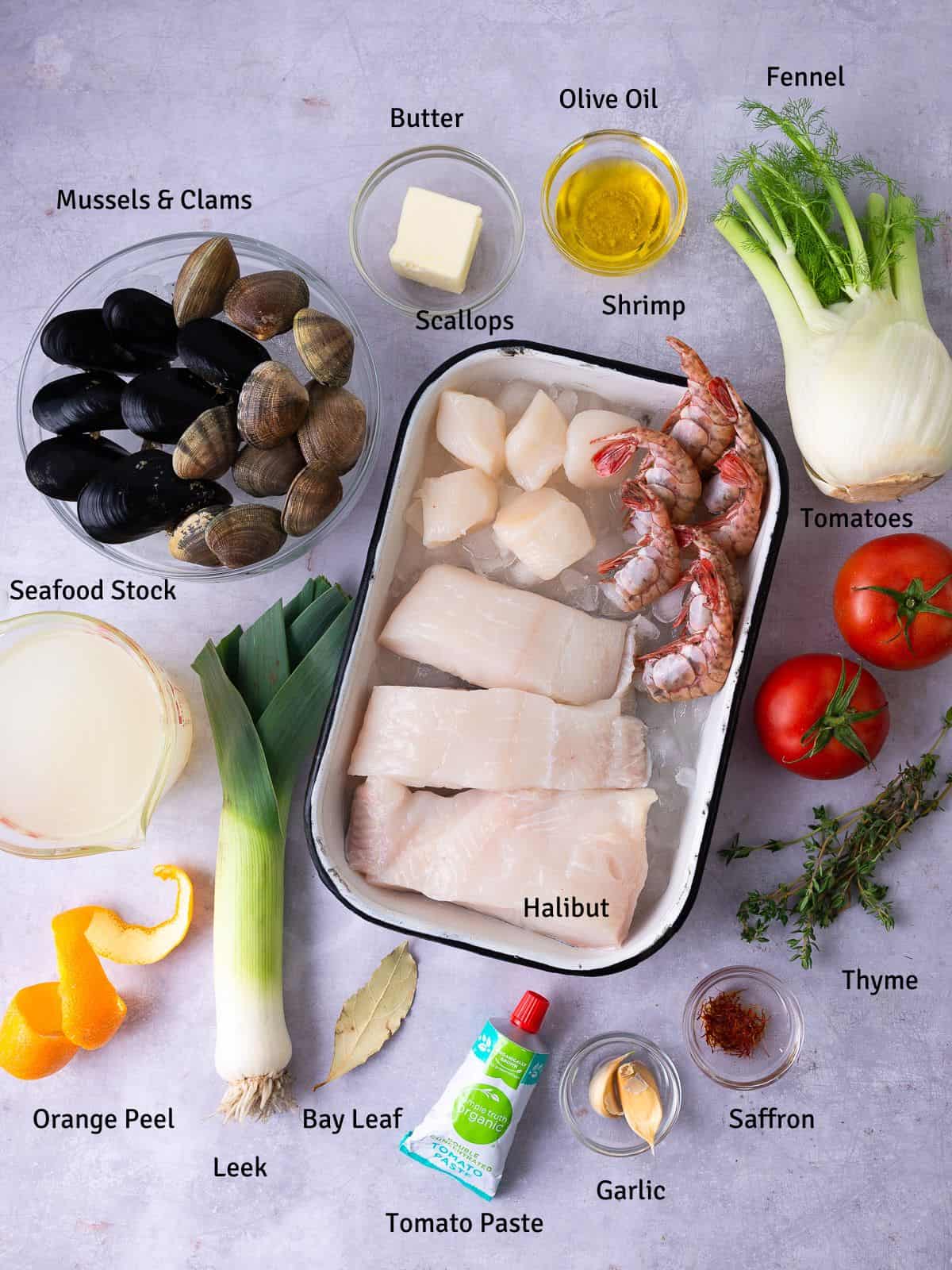 Ingredients for Bouillabaisse, a French seafood stew, including fennel, saffron and assorted seafood.