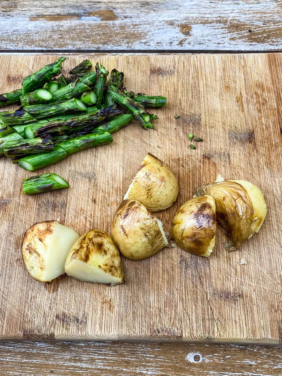 Once the vegetables are grilled, chop up the asparagus and potatoes.